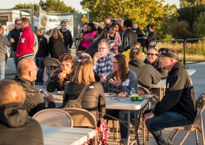Many enjoy a tasty meal at the annual Alumni Homecoming Tailgate. Food donated by Cory Fuller (1989), owner of Pulled BBQ Omaha and Kyron O'Brien (1991), owner of The Union.